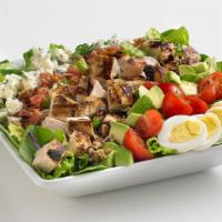 Chicken Cobb Salad · Diced grilled chicken with fresh mixed greens, generously topped with avocado, bleu cheese, ...
