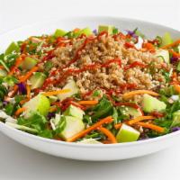 Quinoa Bowl · A quinoa rice blend on top of fresh spinach tossed in vinaigrette dressing with cabbage, shr...