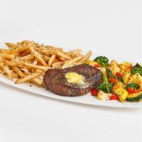 Steak Frites · 8oz. USDA Choice top sirloin grilled to perfection and topped with garlic butter. Served wit...