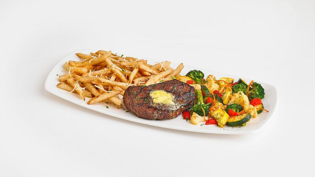 Steak Frites · 8oz. USDA Choice top sirloin grilled to perfection and topped with garlic butter. Served with roasted veggies and truffle Parmesan fries.