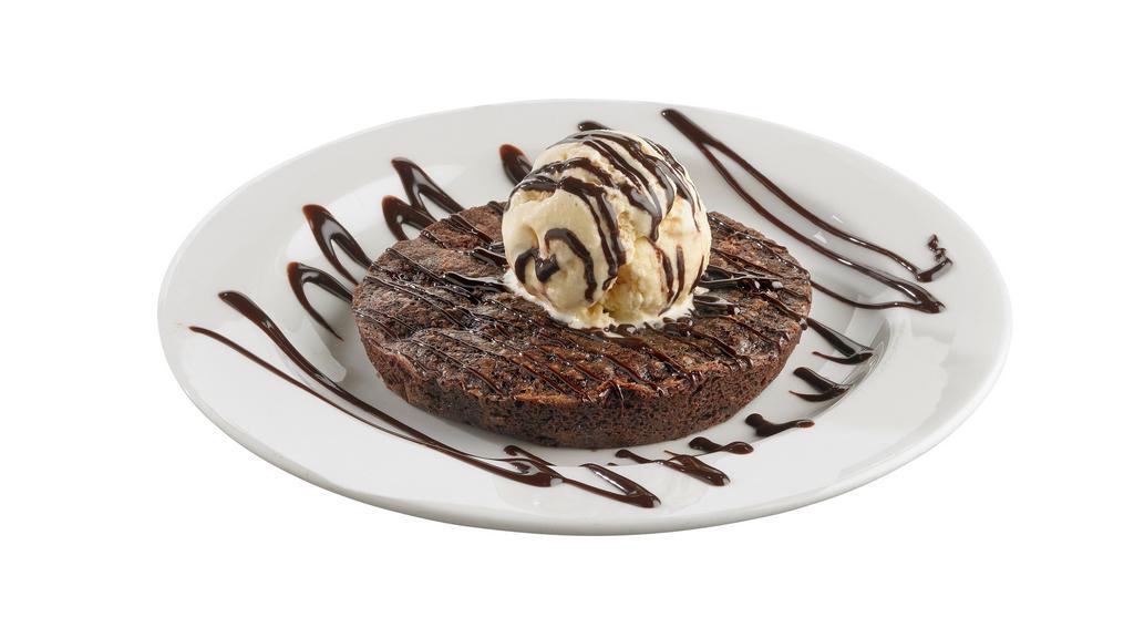 Chocolate Brownie Addiction · Two deluxe brownies served with vanilla ice cream and generously drizzled with chocolate and caramel sauce.