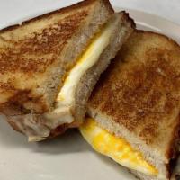 Grilled Cheese Sandwich · Swiss, mozzarella, and mild Cheddar cheese. Comes with your choice of salad or cup of tomato...