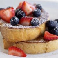Traditional French Toast · Classically prepared French toast, topped with powdered sugar, and fruit. Served with a side...