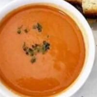 Tomato Soup · Classic tomato soup with basil.