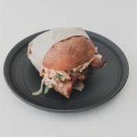 Pork Belly Ssam Sandwich · Gochujang braised pork belly, spicy garlic mayo, asian slaw, on toasted milk bun