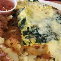 Popeye Omelet · Fresh spinach, bacon, onions, mushrooms and Jack cheese.