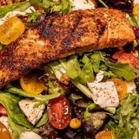 Salmon Salad · 6oz seared blackened salmon, roasted corn, mozzarella and tomato served on a bed of field gr...