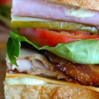 Carving Club · turkey breast, cheddar, thick cut bacon, lettuce, pickles, tomato, ham and our carving sprea...
