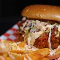 Sandwich And Fries · Large nashville-style boneless chicken breast fried to perfection topped with coleslaw, pick...