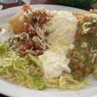 Chimichanga · Deep fried burrito with choice of meat, beans, rice, cheese guacamole, sour cream, Pico de G...