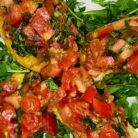 Bruschetta · Toasted ciabatta crostini topped with diced roma tomatoes, fresh basil, olive oil, garlic.
