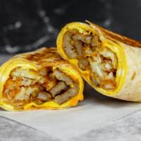 Impossible Sausage, Egg, & Cheddar Breakfast Burrito · Delicious vegetarian option for your savory breakfast burrito. 3 fresh cracked, cage-free sc...