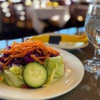 Garden Salad · Lettuce, tomatoes, red cabbage, and Persian cucumber.