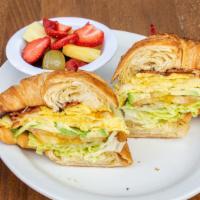 Sunrise Sandwich  · 2 eggs, your choice of protein, jack cheese, avocado, lettuce and tomato served in a croissant