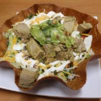 Tostada Bowl · Choice of meat, rice, beans, lettuce, pico, Shredded cheese, cream, and guacamole.