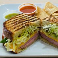 Turkey & Cheese Sandwich · Mayo, mustard, lettuce, tomato, onion, and cheese on sourdough or wholegrain bread.