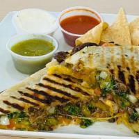 Meat Quesadilla · Large flour tortilla topped with your choice of meat, cheese, onion, cilantro and tomato. Se...