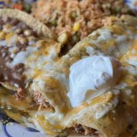 Pico Enchiladas Suizas · Two tortillas dipped in green tomatillo sauce and filled with shredded seasoned chicken. Rol...