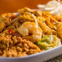 #60. Pad Thai · Traditional Thai dish of stir-fried rice noodle with tamarind sauce, egg, tofu, chicken, shr...