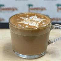Café Con Leche · Espresso and steam milk.
