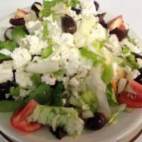 Greek Salad · Romaine lettuce, olives, tomato, pepperoncini, garbanzos, Feta cheese, Greek dressing.