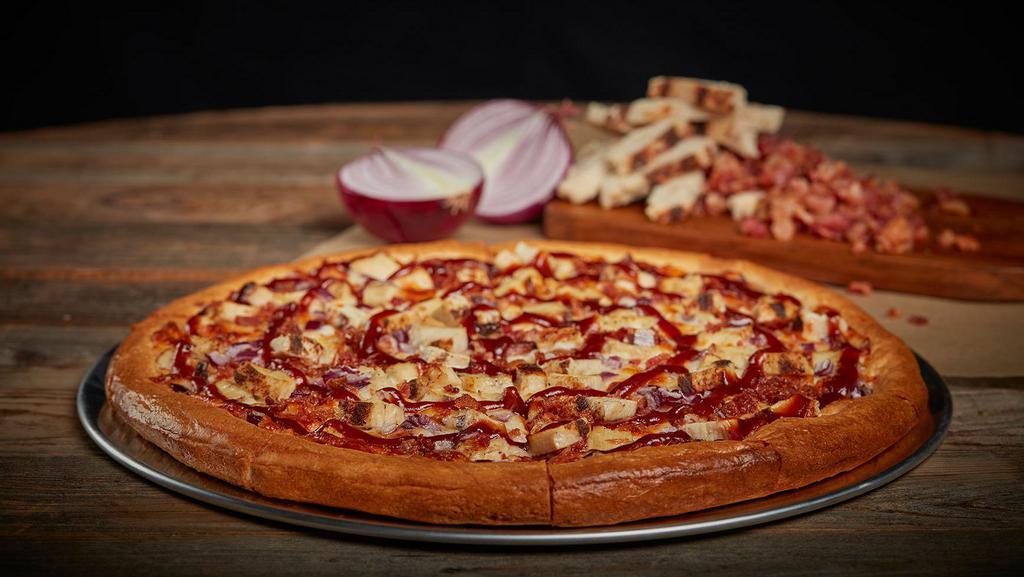 Bbq Chicken Pizza · Our 14” pizza Starts with our Non-GMO Pizza Sauce made from Fresh Vine-Ripened tomatoes. Our two-cheese Mozzarella Cheese Blend followed by our Seasoned White Meat Chicken, Red Onions and a generous glazing of BBQ sauce.