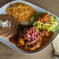 Cochinita Pibil · Gluten-free. Seasoned chunks of pork, marinated in achiote (spice) that is dissolved in a ci...