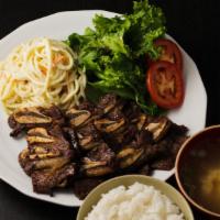 Beef Ribs Bbq · Marinated short ribs, grilled and sliced.