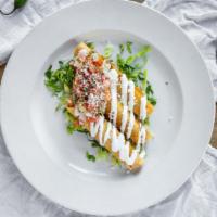 Taquitos · Three crispy rolled corn tortillas, filled with chicken and topped with lettuce, sour cream ...
