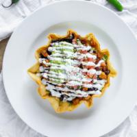 Taco Salad · Romaine lettuce, black beans, rice, your choice of meat, guacamole, pico de gallo, cheese, a...