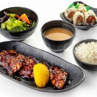 Salmon Teriyaki Combo · Teriyaki seasoned salmon fillet served with rice, miso soup, and salad along with your choic...