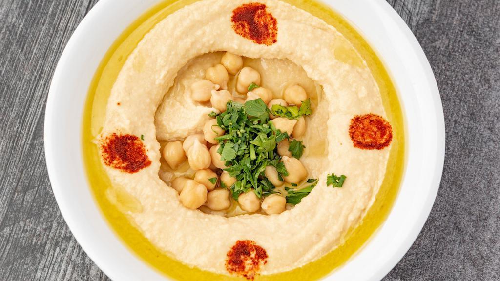Hummus · Crushed Garbanzo Beans Mixed with Tahini, Lemon Juice and topped with Olive Oil and Paprika. (Vegetarian/Vegan) (GlutenFree)
