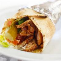 Chicken Shawarma Pita · Seasoned Chicken slowly grilled on our vertical grill, topped with Lettuce, Tomatoes, Pickle...