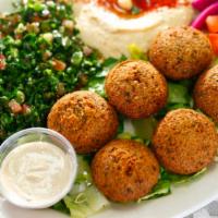Falafel Plate (Dinner) · 6 Falafel Balls served with Hummus, Tabbouleh Salad, Tahini Sauce, and 1 Pita Bread.