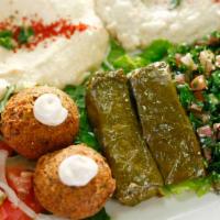 Vegetarian Combo (Dinner) · 2 Falafel Balls, 2 Dolma, Hummus, Mutabal, Tabbouleh Salad, Tahini Sauce, and 1 Pita Bread.