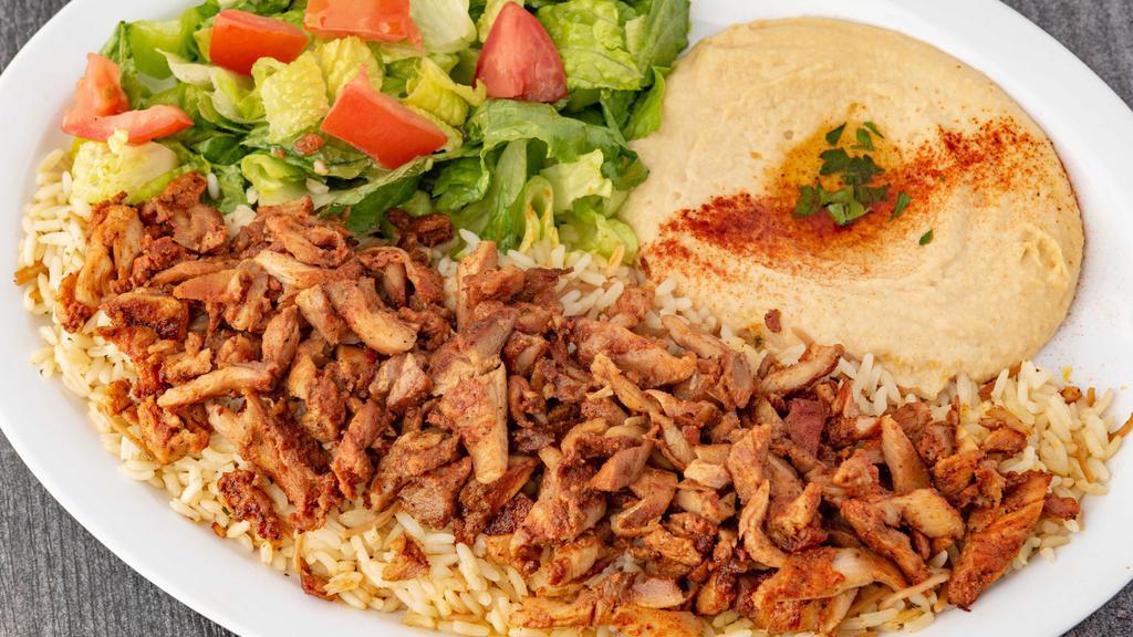 Chicken Shawerma Plate (Dinner) · Seasoned Chicken slowly grilled on our vertical grill. Served with Hummus, House Salad and Rice.