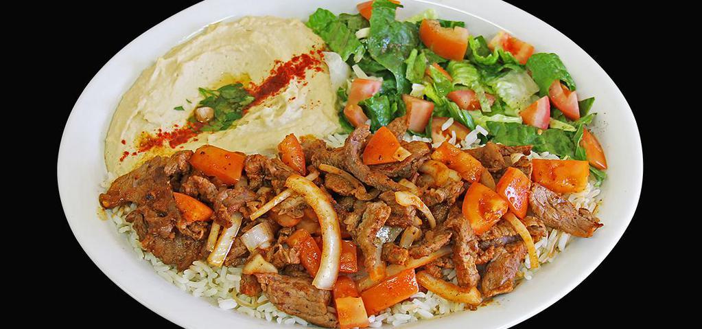 Spicy Chicken Shawerma Plate (Dinner) · Seasoned Chicken slowly grilled on our vertical grill. Served with Spicy Siracha Sauce, Grilled Onions, Grilled Tomatoes, Hummus, House Salad and Rice.