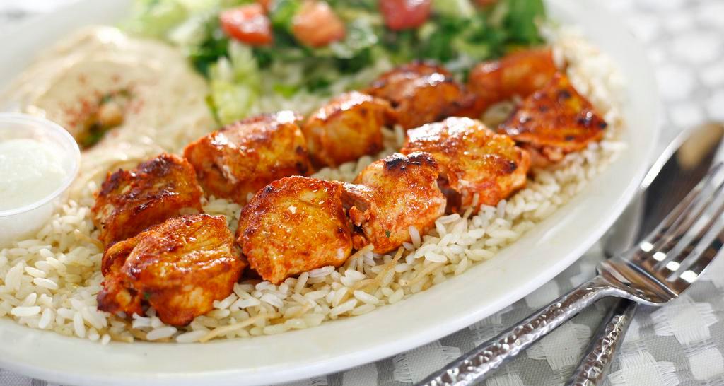 Chicken Kabob (Dinner) · Two Skewers of Marinated Chicken Breast grilled up to perfection and served with Hummus, House Salad and Rice.