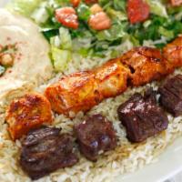 Kabob Combo Plate (Dinner) · A Combination of Two Skewers of Beef, Chicken, or Kafta Kabobs. Served with Hummus, House Sa...