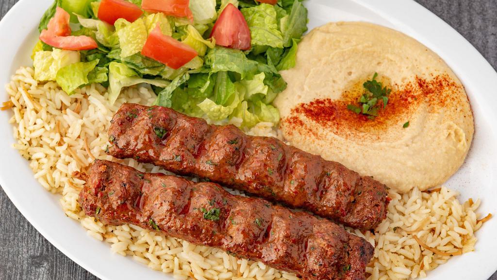 Kafta Kabob (Dinner) · Two Skewers of Marinated Ground Beef Mixed with Chopped Parsley and Onions. Served with Hummus, House Salad and Rice.