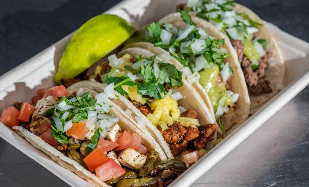 Street Tacos (4) · Choice of meat topped with avocado salsa, onion and cilantro mix in warm corn tortillas steak, chicken, pork pastor, pork carnitas.