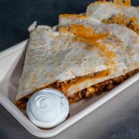 Quesadilla Con Carne · Warm flour tortilla filled with cheese and choice of meat steak, chicken, pork pastor, pork ...