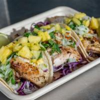 Fish Tacos (3) · Grilled tilapia in a warm corn tortilla topped with shredded cabbage, onion and cilantro mix...