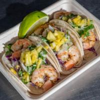Shrimp Tacos (3) · Grilled shrimp in a warm corn tortilla topped with shredded cabbage, onion and cilantro mix,...