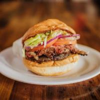 Tri Tip Burger · Burger patty add char roasted Tri Tip, lettuce tomato pickle onion and ranch bbq sauce.