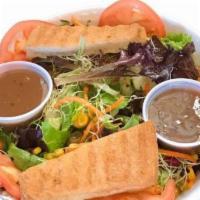 Earth Salad · Baby greens, romaine, carrots, sweet corn, tomato, cucumber, sprouts, Kalamata olives and 4 ...