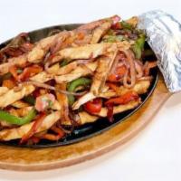 Chicken Fajitas · Grilled Chicken,  red and green bell peppers and onions served with your choice of flour or ...