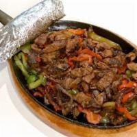 Beef Fajitas · Beef (marinated steak), red and green bell peppers and onions served with your choice of flo...