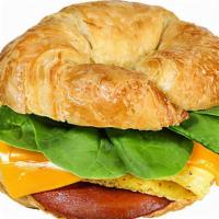 Croissant - 'Canadian Bacon Egg & Cheese' · Canadian 'bacon,' JUST Egg, American 'cheese,' and spinach on a toasted croissant.