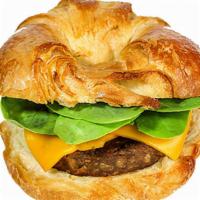 Croissant - 'Sausage & Cheese' · 'Sausage,' American 'cheese,' and spinach on a toasted croissant.